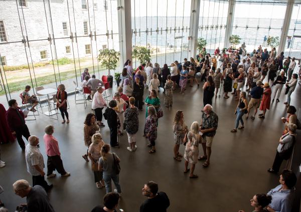 A crowd of concert-goers chat in the Isabel lobby