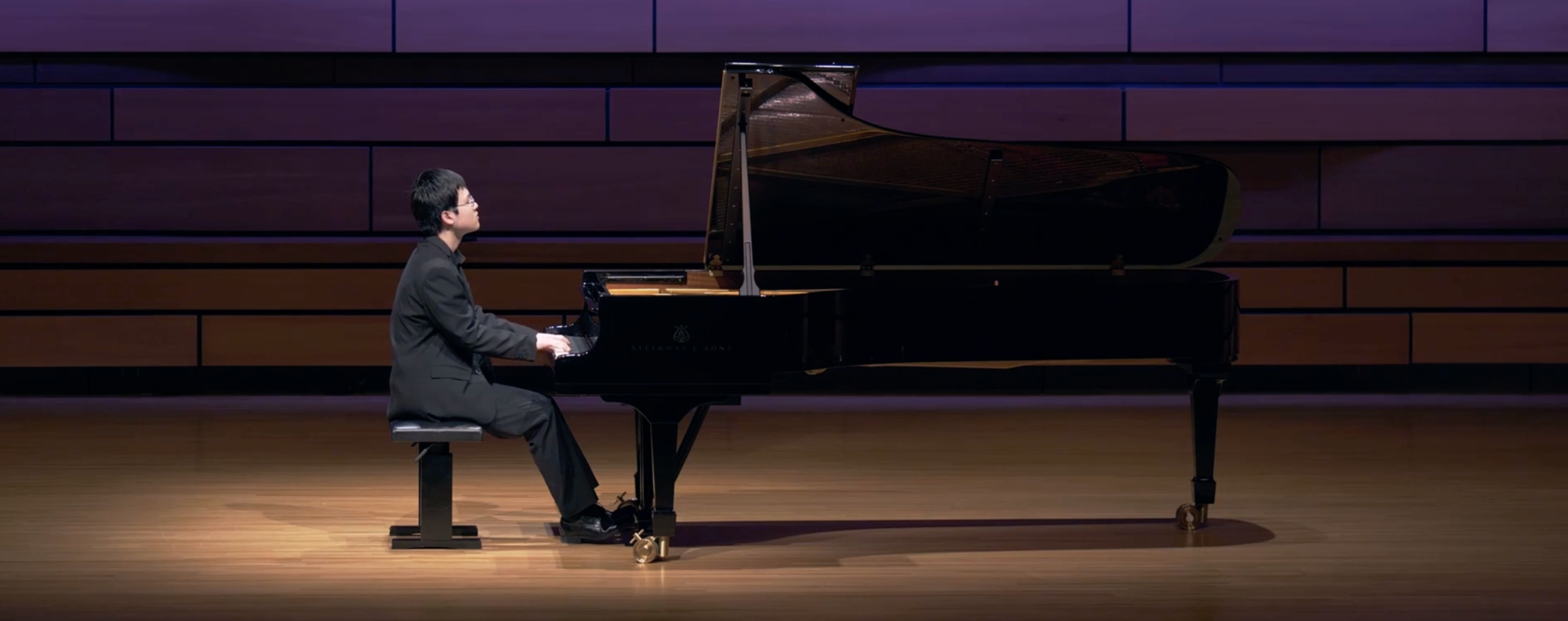 Eric Guo performs at piano