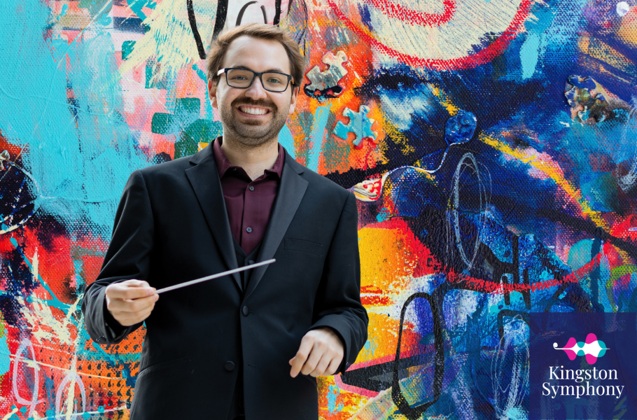 Frédéric-Alexandre Michaud, Guest Conductor, poses in front of a multicoloured background of painted texture