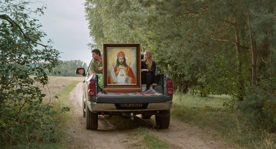 A portrait of Jesus Christ is carried in the back of a truck