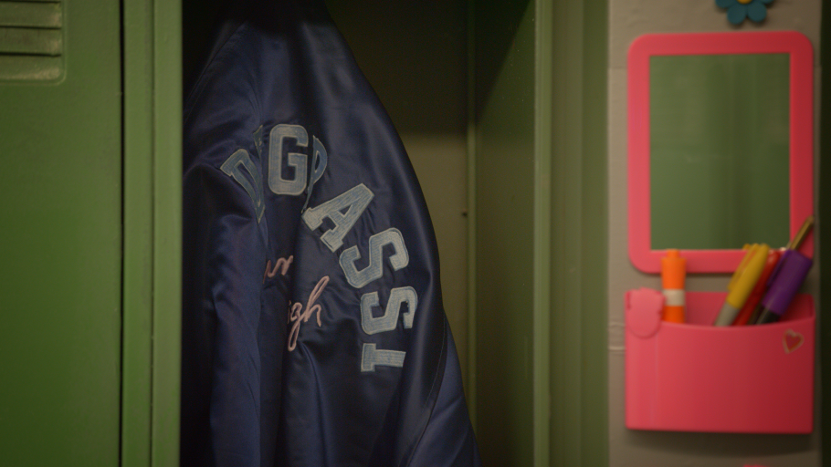 A degrassi jacket hangs in a locker