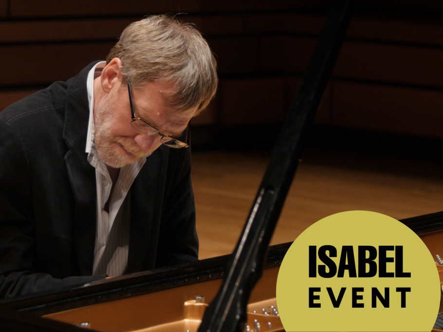 John Burge plays piano with a look of absolute concentration