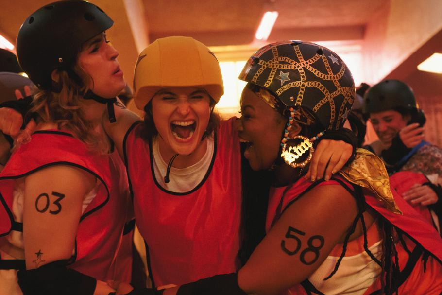 Roller derby players cheer in triumph