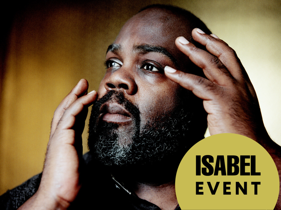 Reginald Mobley poses dramatically with his hands hovering around his face