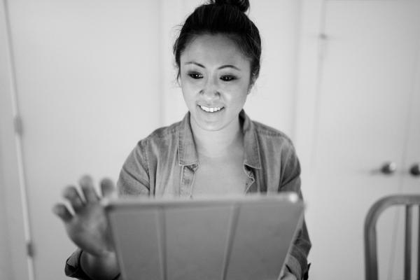 women working on a smart tablet 
