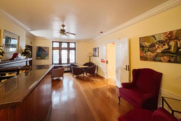 South facing lounge room with wood floors and a fixed bar