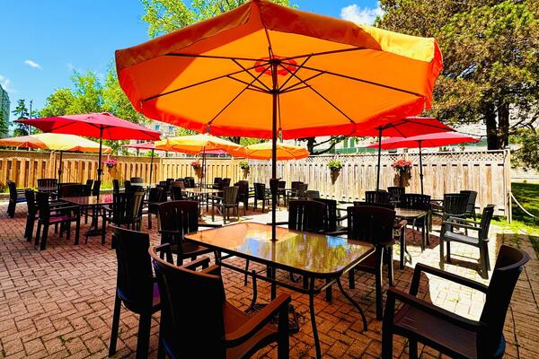 Outdoor patio with umbrellas and seating