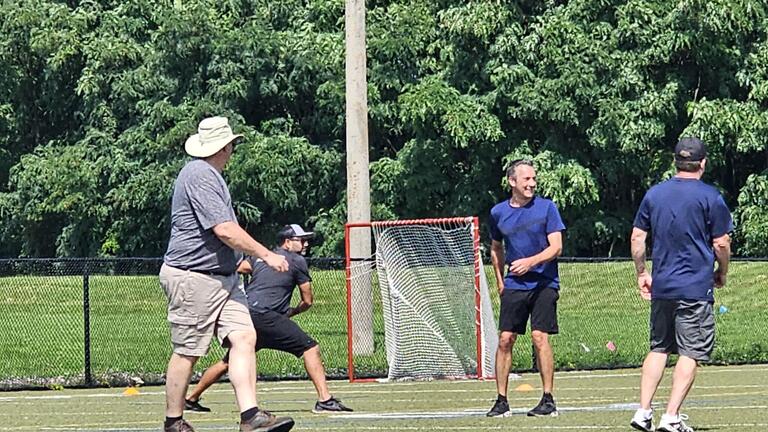 Colleagues playing a sport together