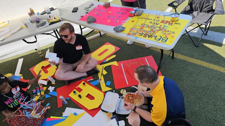 Staff working on posters