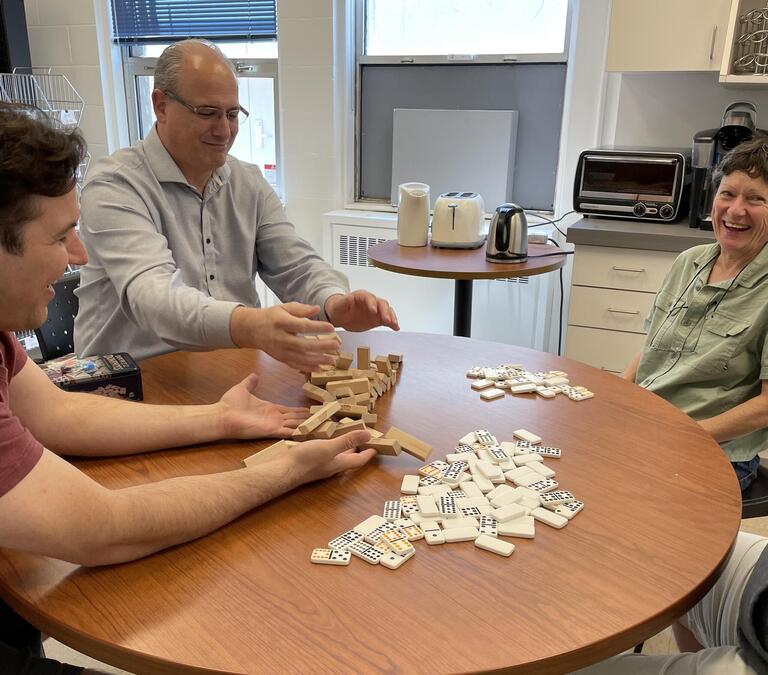 Coworkers playing game and laughing together