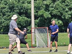 Colleagues playing a sport together