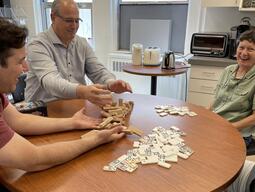 Coworkers playing game and laughing together