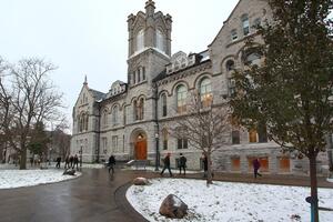 a historical building in winter with snow on the ground