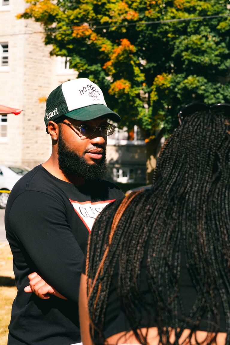 black man standing outside in the sun