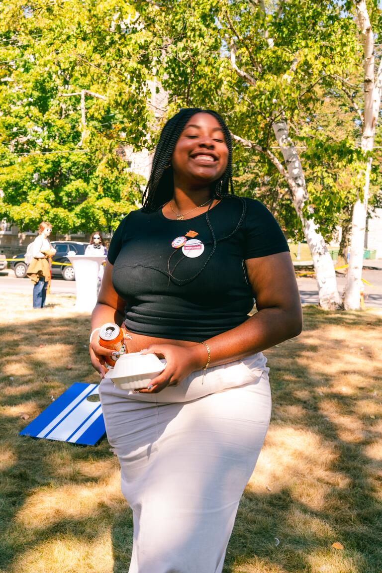 black woman posing outside at the barbeque