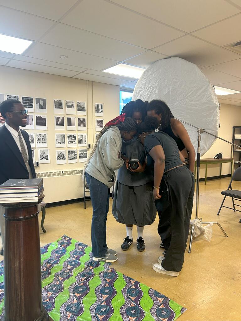 group of people looking into a camera